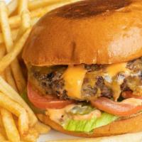 All-American Burger · A 1⁄2 lb beef patty with lettuce, tomato, onion, pickles, cheddar cheese and thousand island...