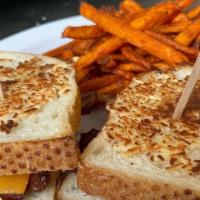 Loaded Grilled Cheese · Applewood smoked bacon, tomato, provolone cheese, cheddar cheese and sourdough bread crusted...