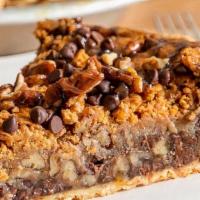 Cookie Pie · A giant soft and chewy Chocolate Chip Cookie filled with chocolate cream and white chocolate...