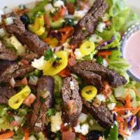 Lula Kebab Salad · Gluten-free. Romaine, ground beef kebabs, feta cheese, California olives, onion, tomato, cuc...