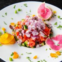 Shirazi Salad · Medley of fresh hand-chopped cucumbers, tomatoes, red onion, parsley, and our house sour gra...