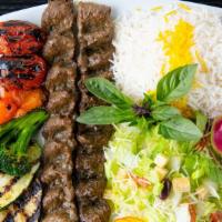Party Combo 5  ( Serve 3 ) · 6 Skewers Koobide
served with choice of : Caesar, Greek or Garden Salad AND Basmati Rice AND...