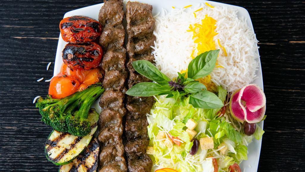 Party Combo 5  ( Serve 3 ) · 6 Skewers Koobide
served with choice of : Caesar, Greek or Garden Salad AND Basmati Rice AND Grilled Vegetables