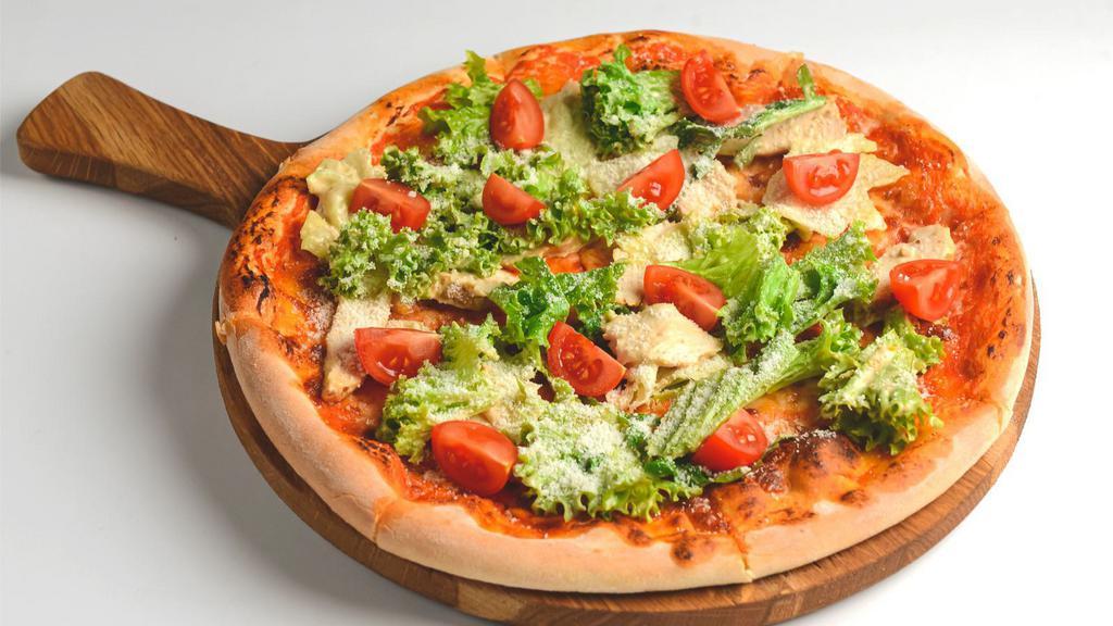 Chicken Veggie Pizza · Mouthwatering pizza topped with Chicken, green and red peppers, onions, and olives.