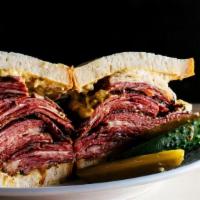 Pastrami Melt · Griddled sandwich with pastrami, melted Swiss cheese, dijon mustard, and your choice of bread.