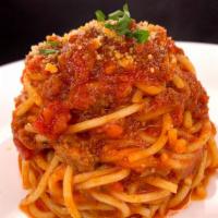 Spaghetti Bolognese · Includes Garlic Bread.