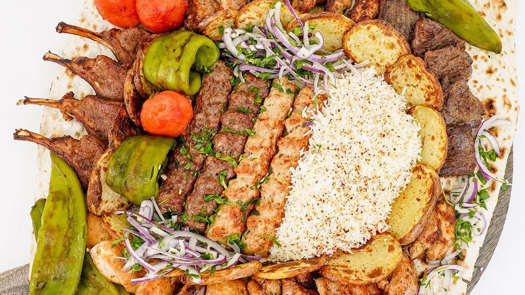 Family Kabob Platter #1 · Leave the grilling to Art's Cafe and enjoy a Family Kabob Platter with a combination of Beef, Chicken, Pork, and optional New Zealand Lamb Chops.
3 Serving Sizes to choose from (6, 12, and 16  Servings).
...
OPTION 1 (Up to 6 Servings) $129.99
...
1 Skewer of Beef Kabobs (5 Pieces),
1 Skewer of Chicken Kabobs (5 Pieces),
2 Skewers of Beef Lulah,
2 Skewers of Chicken Lulah,
1 Skewer of Baby Pork Boneless (5 Pieces),
1 Skewer of Pork Ribs (5 Pieces),
Baked sliced Potatoes (20 pieces),
Rice Pilaf,
Grilled Tomatoes (6 pieces),
Grilled Green Peppers  (6 pieces),
...
OPTION 2 (Up to 12 Servings) $259.99
...
2 Skewers of Beef Kabobs (10 Pieces),
2 Skewers of Chicken Kabobs (10 Pieces),
4 Skewers of Beef Lulah,
4 Skewers of Chicken Lulah,
2 Skewers of Baby Pork Boneless (10 Pieces),
2 Skewers of Pork Ribs (10 Pieces),
Baked sliced Potatoes (35 pieces),
Rice Pilaf,
Grilled Tomatoes (12 pieces),
Grilled Green Peppers  (12 pieces),
...
OPTION 3 (Up to 16 Servings) $376.99
...
3 Skewers of Beef Kabobs (15 Pieces),
3 Skewers of Chicken Kabobs (15 Pieces),
6 Skewers of Beef Lulah,
6 Skewers of Chicken Lulah,
3 Skewer of Baby Pork Boneless (15 Pieces),
3 Skewer of Pork Ribs (15 Pieces),
Baked sliced Potatoes (40 pieces),
Rice Pilaf,
Grilled Tomatoes (16 pieces),
Grilled Green Peppers  (16 pieces)
...
*Add a skewer of New Zealand Lamb Chops to your platter. Each Skewer has 4 pieces.
**Grilled tomatoes and green peppers do not come peeled.
***Rice, potatoes, grilled tomatoes, and green peppers come separately packaged.