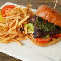 Flat Iron Steak Sandwich · Served on Brioche bun, pickle, onion, tomatoes, avocado, lettuce with Chimichurri Sauce, and...