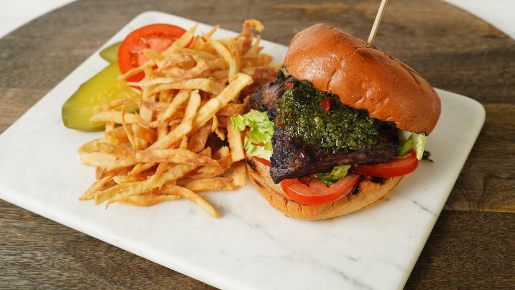 Flat Iron Steak Sandwich · Served on Brioche bun, pickle, onion, tomatoes, avocado, lettuce with Chimichurri Sauce, and French Fries.