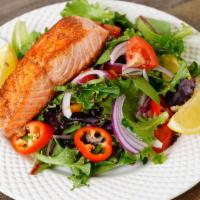 Garden Spring Grilled Salmon Salad · Made fresh daily with mixed baby greens, cherry tomatoes, onions, and bell pepper with vineg...