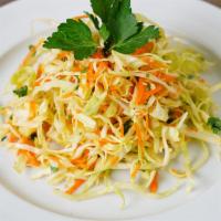 White Cabbage Salad · Made fresh daily with white cabbage mix, sliced carrots, fresh mint, and fresh orange juice ...