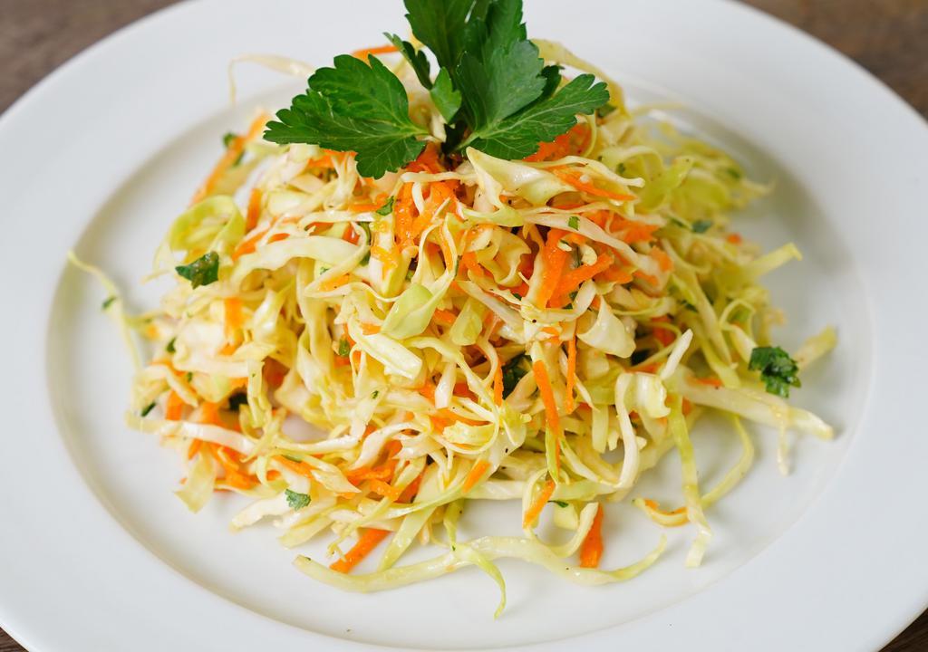 White Cabbage Salad · Made fresh daily with white cabbage mix, sliced carrots, fresh mint, and fresh orange juice vinegar sauce. (Per lb.)