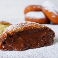 Hazelnut Spread Ponchiks · Art's infamous deep-fried doughnut filled with hazelnut spread.