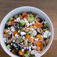 Mediterranean Chickpea Salad · Treat yourself to a Mediterranean special. Chickpeas, snappy bell peppers, cucumber, red oni...