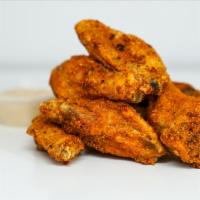 12 Classic Bone-In Wings · 12 Classic bone-in chicken wings tossed with wing sauce and served with fresh celery sticks ...