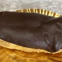Chocolate Eclair · Chocolate Ganache dipped
with sweet cream and custard filling.