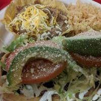 #2. Two Beef Tacos · Two corn hard shell tacos filled with shredded beef, lettuce and cheese.