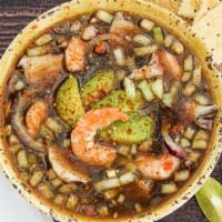 Levanta Muertos · raw shrimp, clam, oyster, octopus, onion, cucumber, clamato in aguachile
