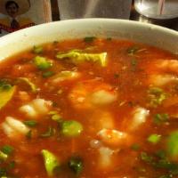 Menudo · A traditional favorite. Made with tripe, hominy, garlic and red chile.