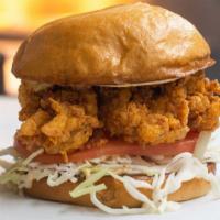 Fried Lobster Tail Burger · Fried Lobster Tail, Cabbage, Tomato, Pickles, Remoulade Sauce, Brioche Bun