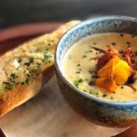 Corn & Crab Chowder · Blue crab, sweet yellow corn, smoked bacon bits, grilled baguettes.