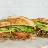 Vegetarian Sandwich · Grilled onions, mushrooms and green peppers layered with lettuce and tomatoes on a sour doug...
