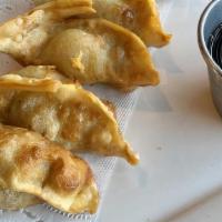 Gyoza · Six pieces deep-fried chicken and veggie dumplings.