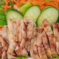 Grilled Chicken Salad · Lettuce, carrot, cucumber, grilled chicken, sesame soy dressing.