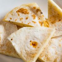 Regular Quesadilla · Delicious flour or corn tortilla with melted cheese.
