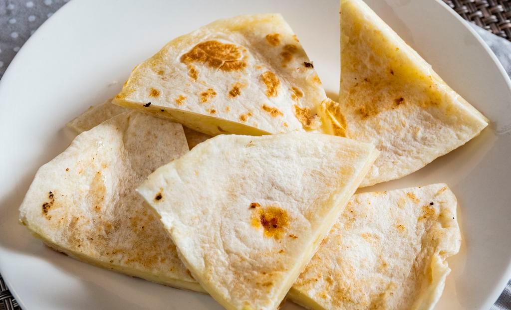 Regular Quesadilla · Delicious flour or corn tortilla with melted cheese.