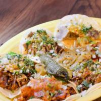 Tacos De Lengua · Original street taco. Onions, cilantro, & salsa.