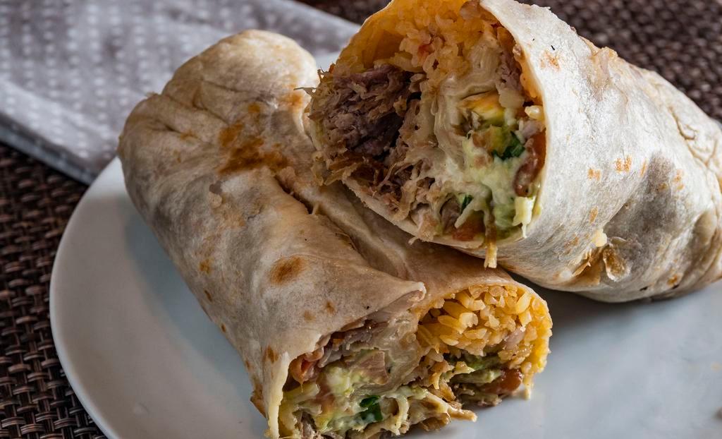 Super Burrito · Your choice of meat, rice, beans, salsa, guacamole, sour cream, & cheese.