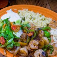 Shrimp Fajitas · Shrimp grilled with onions, tomatoes and bell pepper.