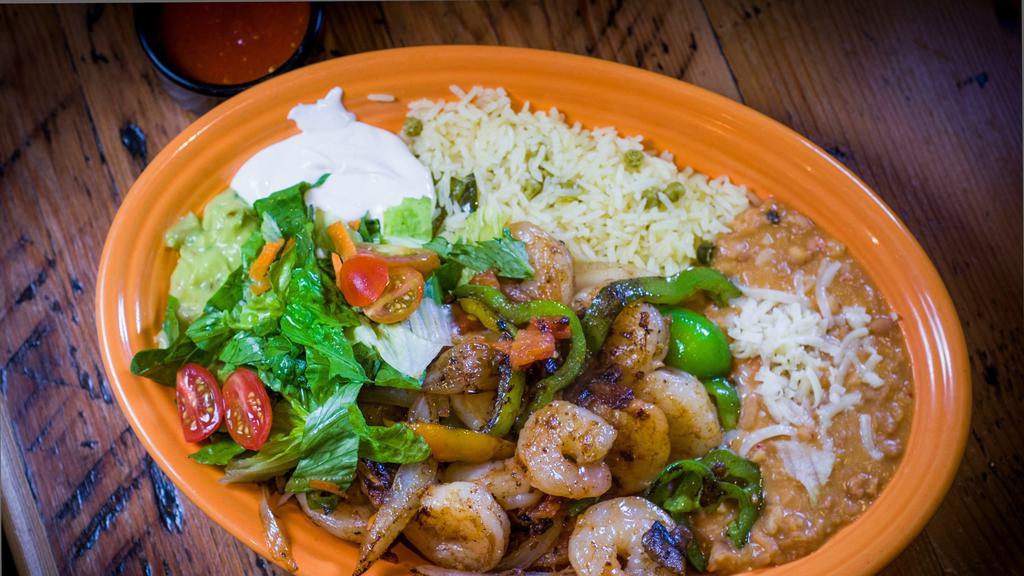 Shrimp Fajitas · Shrimp grilled with onions, tomatoes and bell pepper.