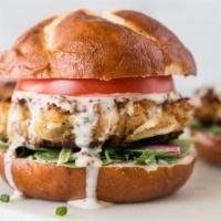 Maryland Crab Cake Sandwich · Served with lettuce, tomato, remoulade, and brioche bun.