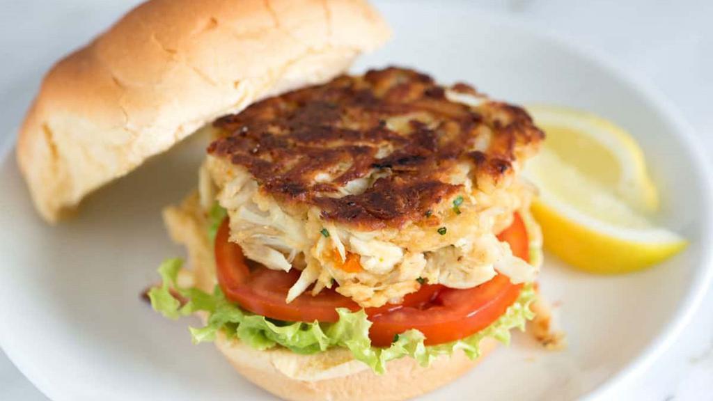 N'Awlins Crab Cake Sandwich · Cajun spiced crab cake. Served with lettuce, tomato, remoulade, and brioche bun.