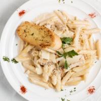 Chicken Alfredo Penne Pasta · Grilled chicken strips in penne pasta with our alfredo sauce topped with parmesan cheese, an...