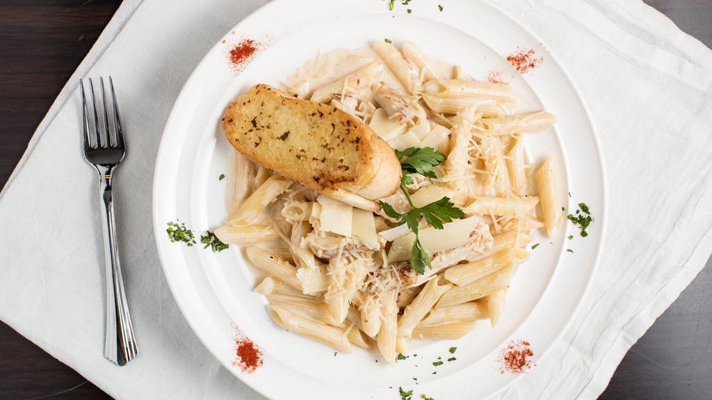 Chicken Alfredo Penne Pasta · Grilled chicken strips in penne pasta with our alfredo sauce topped with parmesan cheese, and comes with garlic bread.