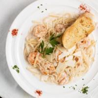 Shrimp Alfredo Linguine Pasta · Grilled shrimp in linguine pasta with our alfredo sauce topped with parmesan cheese, and com...