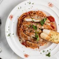 Chicken Parmesan Pasta · Parmesan crusted fried chicken over spaghetti with marinara sauce, comes with garlic bread.