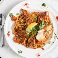 Jambalaya Linguine Pasta (Spicy) · A mix of shrimp, chicken, andouille sausage, vegetable, topped with grilled cajun salmon, an...