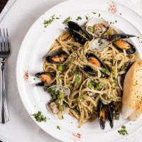 Seafood Garlic & Basil Pasta · Clams and mussels in garlic and basil linguine and comes with garlic bread.