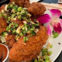 Salt & Pepper Chicken Wings (6) · Chicken wings sautéed with green onions, garlic & crushed red peppers
