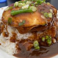 Loco Moco · Hawaiian dish. Grilled seasoned beef patty covered with a rich gravy & topped with one over ...