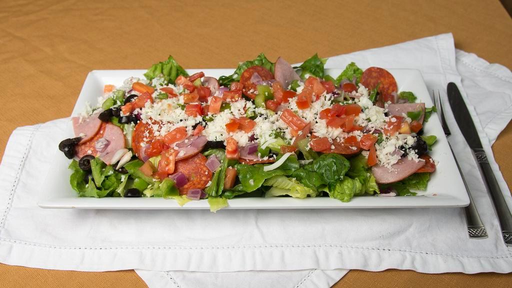 Antipasto Salad · Lettuce, tomatoes, cheese, pepperoni, ham, mushrooms, onions, green peppers and black olives.  With your choice of Ranch or Italian Dressing served on the side.