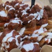 Buffalo Fries · Breaded chunks of Chicken breast battered in our house saucepans over fries. Topped with, Bu...