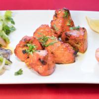 Chicken Tikka Lunch · Boneless chicken breast marinated in yogurt, rare spices, fresh lime juice, and saffron, bar...