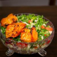 Chicken Tikka Salad · Chicken tikka, lettuce, cucumber, red onion, tomatoes tossed with homemade Indian dressing.