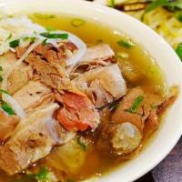 Brisket Pho · Brisket in beef broth garnished with onion, scallion, cilantro, and a side of bean sprouts, ...