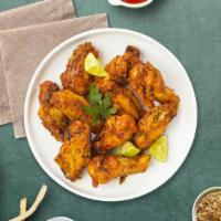 Lulu Lemon Pepper Wings · Fresh chicken wings fried until golden brown, and tossed in lemon pepper sauce. Served with ...